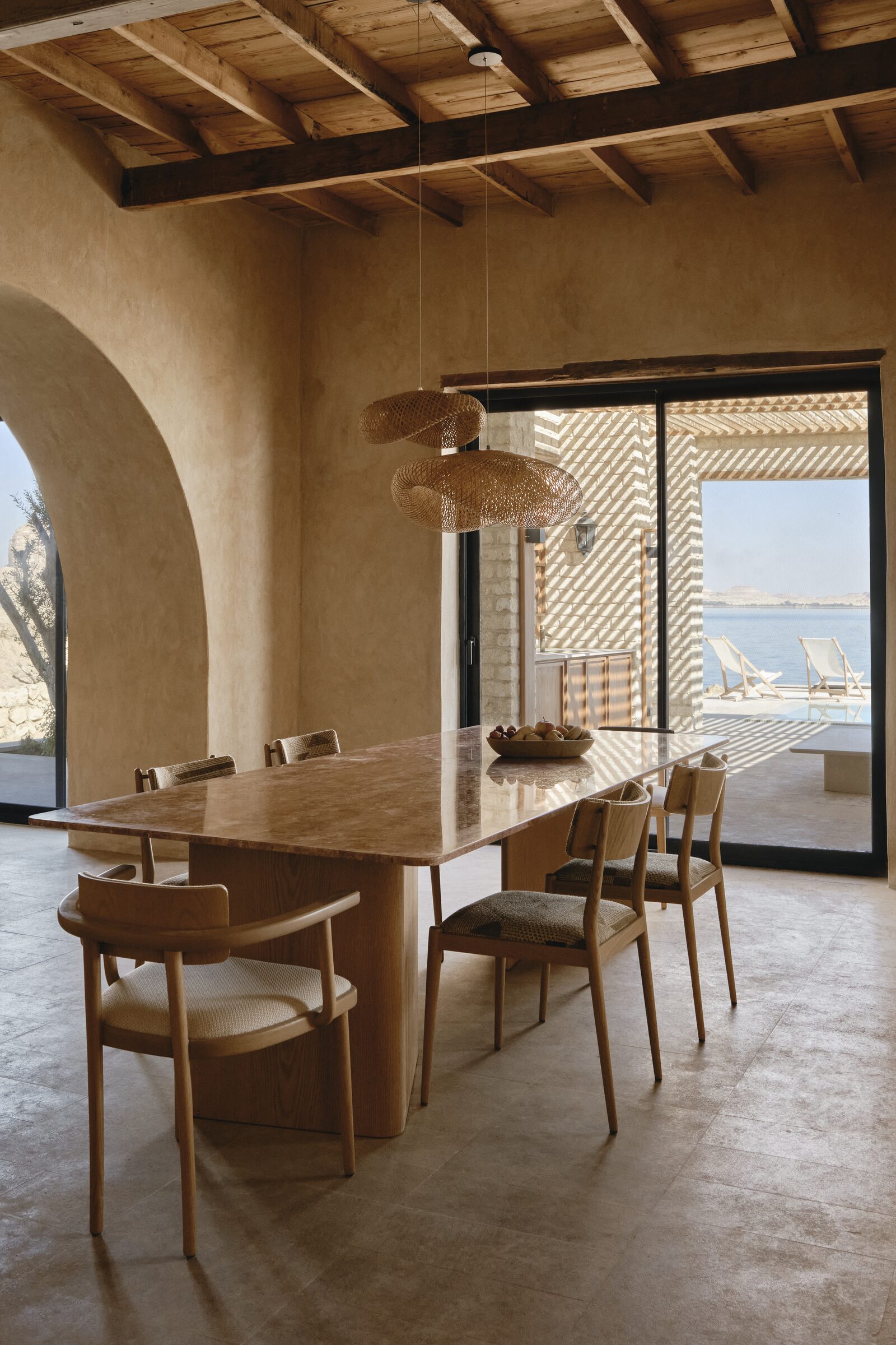 Long dining table open to the lake